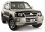 Защита передних фар карбон Mitsubishi Pajero (2000-2006